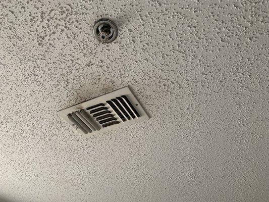 blackened vent on the ceiling