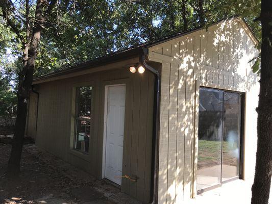 Full garage transformation with sliding door and window installed