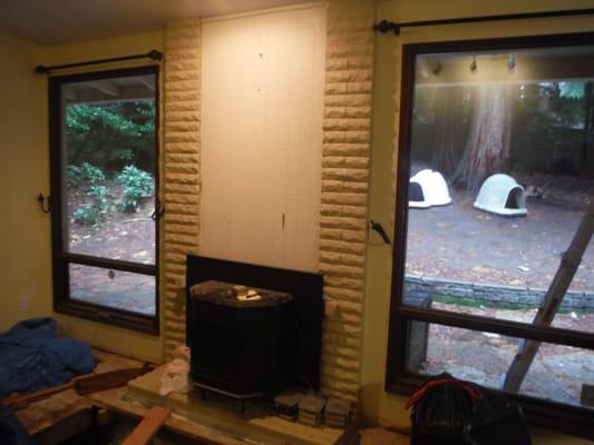 Before Photo-We rebuilt this fireplace face with Profit Ledgestone.