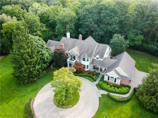 Elegant Colonial Estate on two lush, private acres in the heart of Bingham Farms!