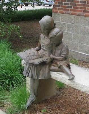 Statue by Nick Klepinger, located in front of the library.