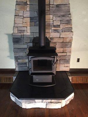 Kodiak 1200 with Hearth pad and cultured stone.