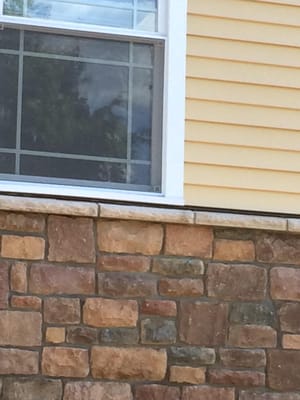 Stone facing over existing concrete wall