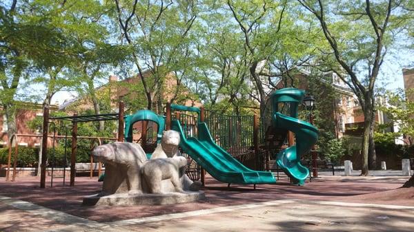 Nice park/playground ~4picnic tables, ~16 benches. Location not fenced in and bordered by (lower traffic?) roads.