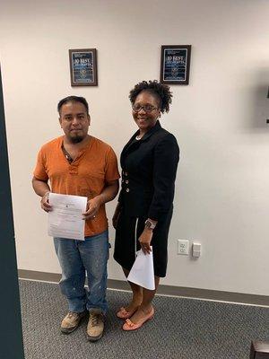 Attorney Lawrence with client who just received his green card from I601A waiver