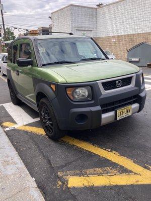 This woman was parked here for over an hour blocking the crosswalk and entrance into the laundromat.