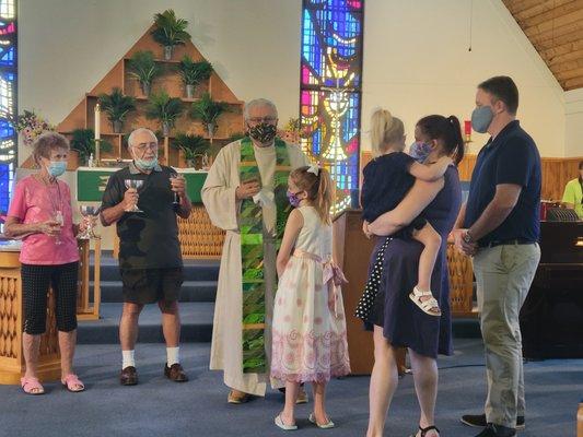 Receiving their 1st Communion.