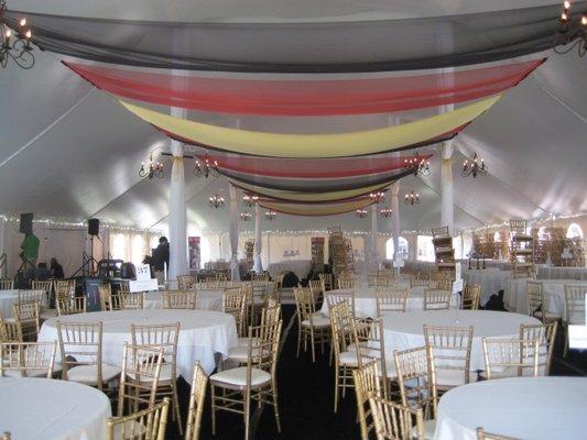 Multi colored ceiling drapery, gold Chiavari chairs