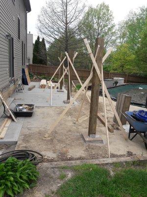 Setting the posts to prepare for the patio cover.