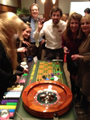 Guest Having FUN Playing Roulette at a Holiday Event! (Gaming Tables are provided for Amusement & Entertainment Purposes only-No Real Bets)