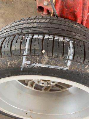 Nail in tire that matches the other nails I picked up in the parking area.