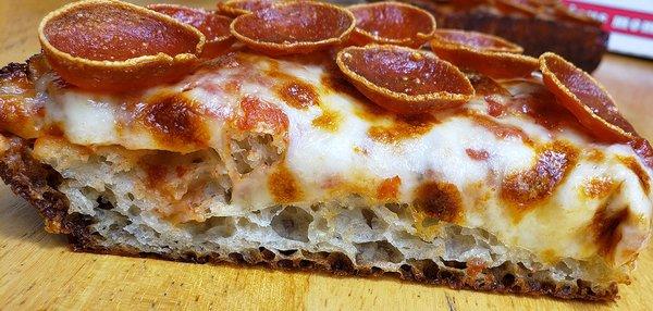 Pepperoni slice showing interior crust