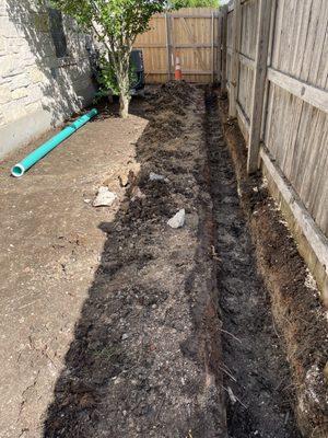 The ditch for the French drain.