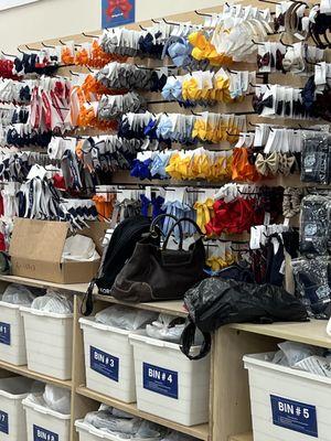 Women's purses held behind the counter.