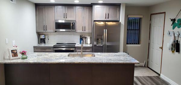 Rustic Birch Cabinets and White Ice Granite.