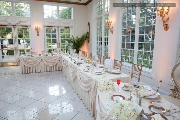 Table decorations, such as floral centerpieces, create a big difference in any wedding reception. Photo was taken at the Patrick Haley Mansi