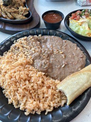 Rice beans, and part of a taquito