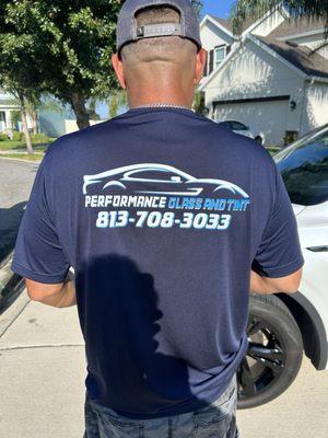 Chris displaying company tee.