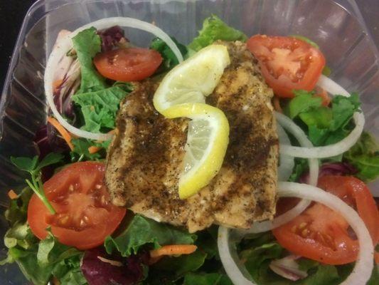 Grilled Salmon on a bed of fresh garden salad mixed with Kale. All kinds of delicious!