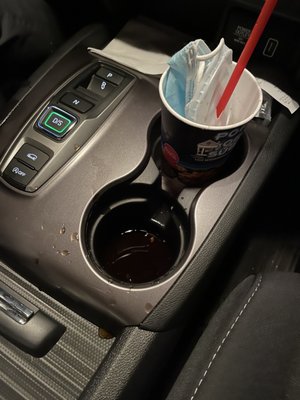 An inch deep puddle of cold sugar water in my cup holders.