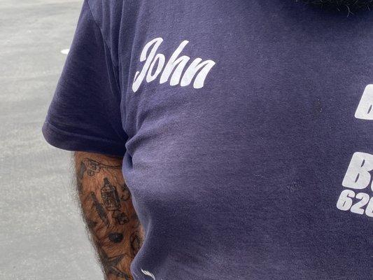 His name John on his shirt