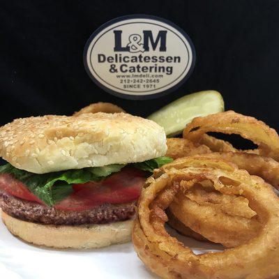 L&M Deli's classic 6 ounce Beef Burger Deluxe with onion rings.Order through www.chelseadelivery.nyc