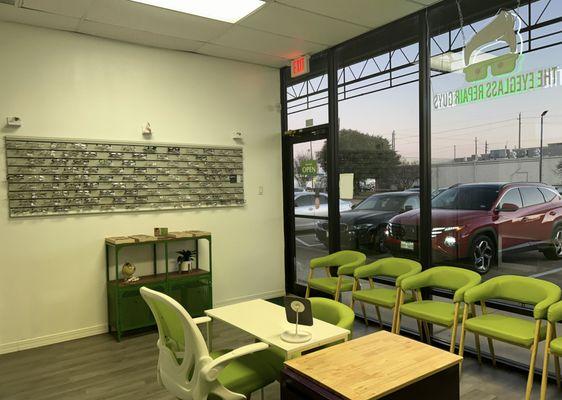 Inside of shop showing eyeglasses and seating, also dispensing table