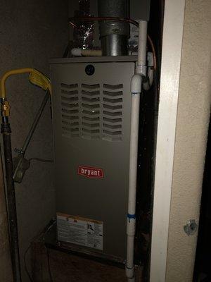 Up flow 80% gas furnace in closet.