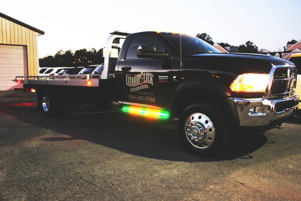 Custom lighting package on a tow truck for Lizard Lick Towing.