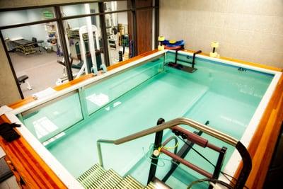 Aquatic therapy pool with an underwater treadmill. Pool water  temperature is kept at a constant 96.0 degrees.