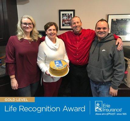 Dolbow Insurance Agency, located in Westerville, Ohio, accepts the Gold Life Recognition Award from Erie Insurance. (614) 899-1611.