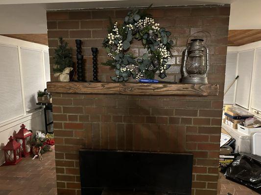 Custom fireplace mantle installed. We carved it out of a 6ft chunk of tree that was on the property.