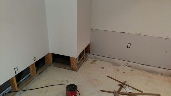 Flooded out basement. Had to  recut walls two foot up from the floor,hang drywall,tape,and finish. Retrimmed full basement