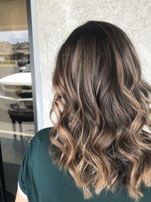 Highlights with a root smudge for a more blended grow out.