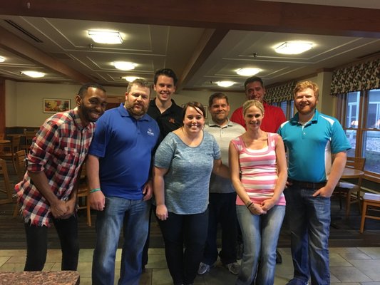 Team at the Ronald McDonald house volunteering making meals for terminally ill children and their families.