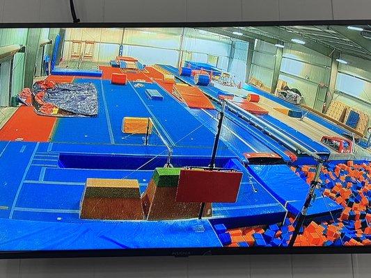 Foam block pit room and trampoline tracks used for amplifying safety while teaching proper techniques.