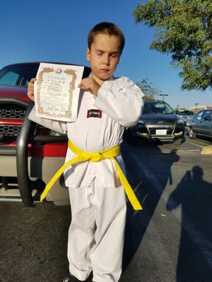 My 8 year old achieving his yellow belt