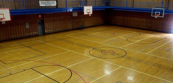 We offer a full size, six goal gymnasium with a hardwood floated floor. Basketballs are provided, and pickup games happen regularly.