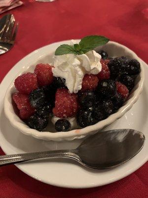 Berries nestled in non-dairy vanilla bean cream for dessert