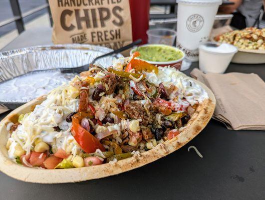 Smoked Brisket Bowl ($11.80), Chips ($1.65), Large Guac ($4.90), Chicken Bowl ($8.25). Tax $2.37. Total $28.97. Brisket limited time only.