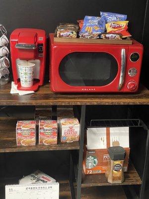 Snack area with coffee and snacks and water