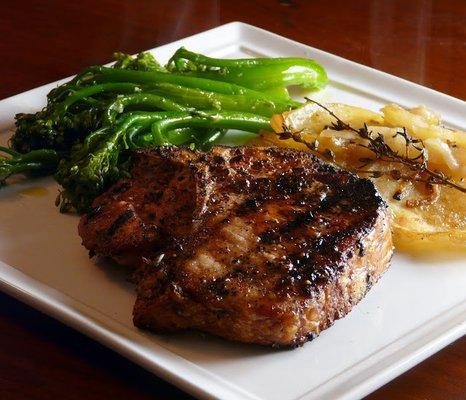 Grilled Pork Chop with Truffled Potato Gratin and Asian Greens