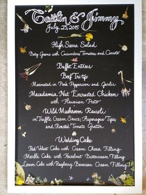 A step above regular chalk board menus, includes dried pressed wildflowers form Mother Nature.