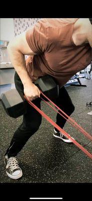 Yours truly performing banded single arm dumbbell rows.