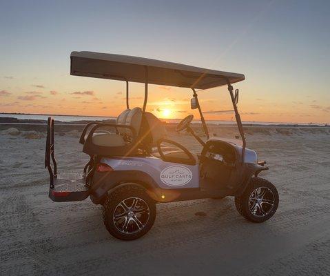 Golf cart and sunrise at jetty