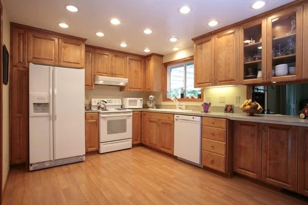 recessed lighting, white appliances, birch cabinetry