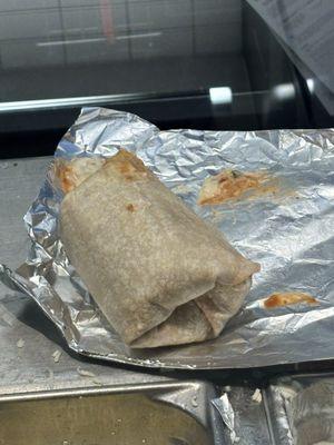 the bottom is both of the ends of the burrito just tucked under waiting to come undone when i unwrap the foil.