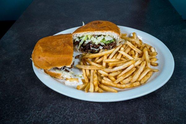 #13 Torta Plate: Locally made Telera Bun, with your choice of Protein, and served with French Fries.