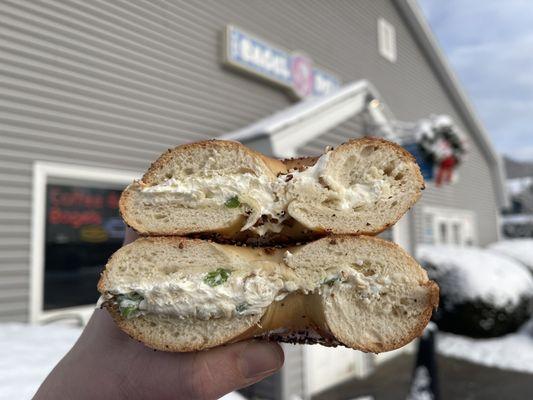 Scallion cream cheese on an everything bagel