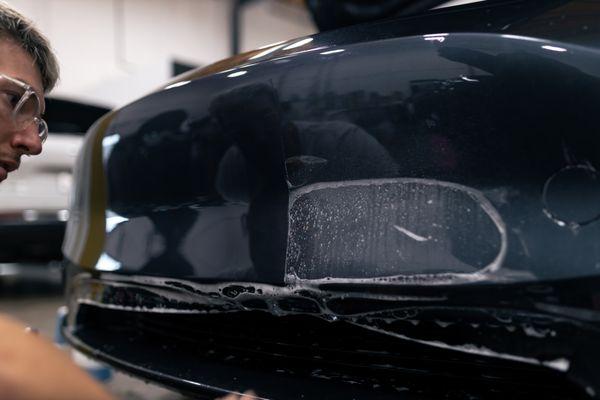 PPF installation on a Tesla front bumper.